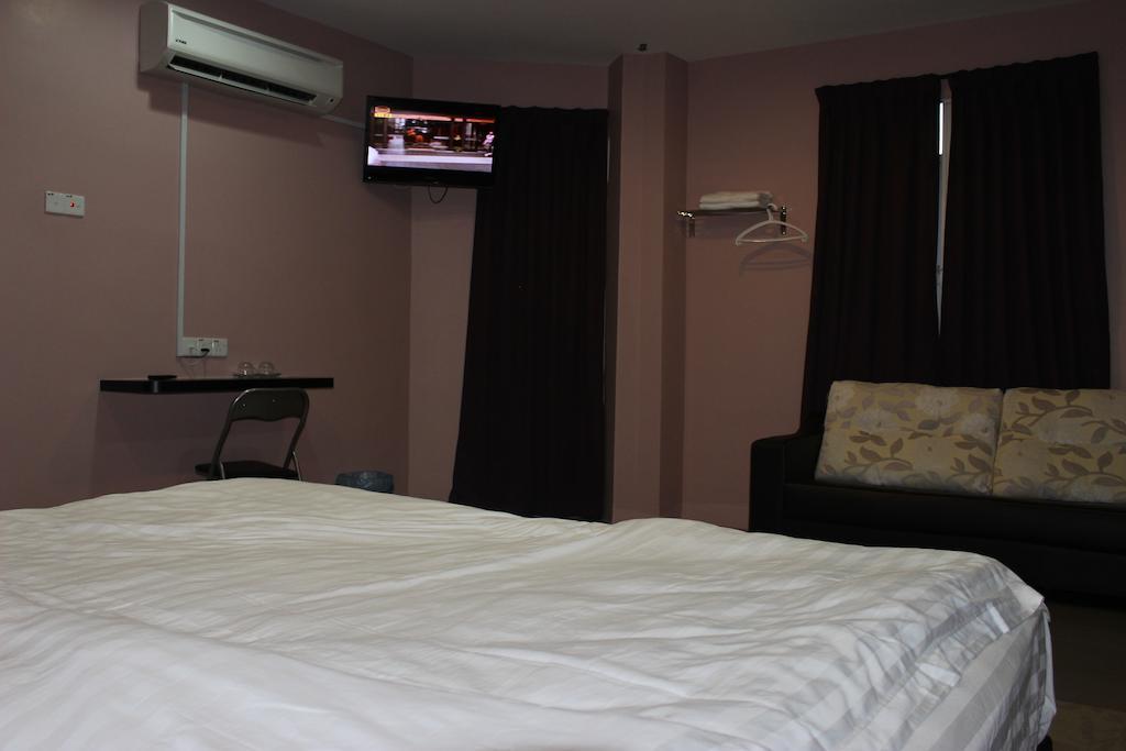 Inn Hotel Телук Интан Стая снимка